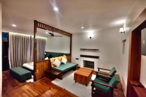 a living room with a couch and a fireplace at Desert Oasis Camp And Resort in ladakh