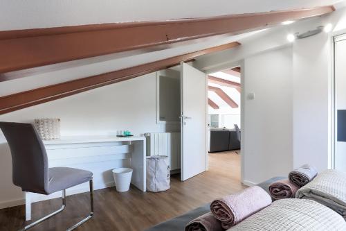 a living room with a couch and a chair at Apartments Victoria in Dramalj