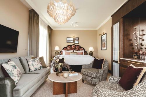 a hotel room with a bed and a couch at Rox Resort in Køge