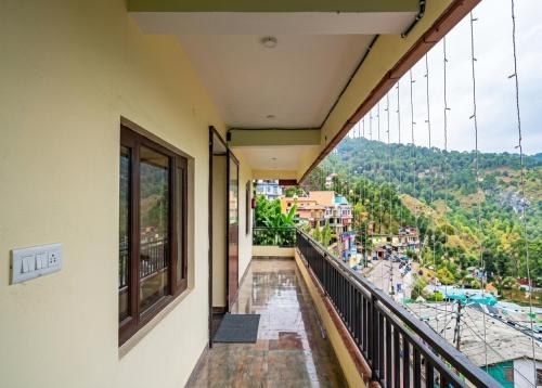 a balcony with a view of a city at Hotel Almora Palace in Almora