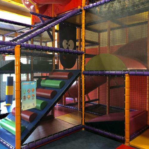 a playground with a climbing ladder and a play structure at Camping ’t Veld in Rheeze