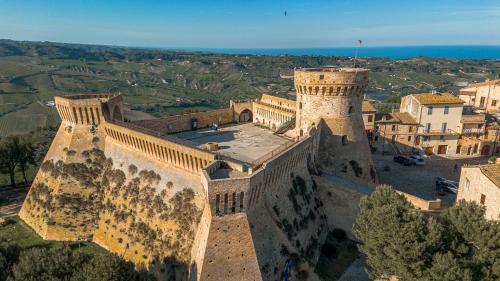 an aerial view of a building with a tower at Hotel Oviv - La dimora del Borgo in Acquaviva Picena