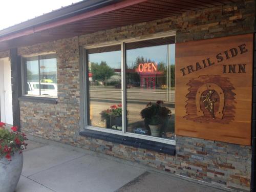a brick building with a sign that reads trailside inn at Trailside Inn in Lloydminster