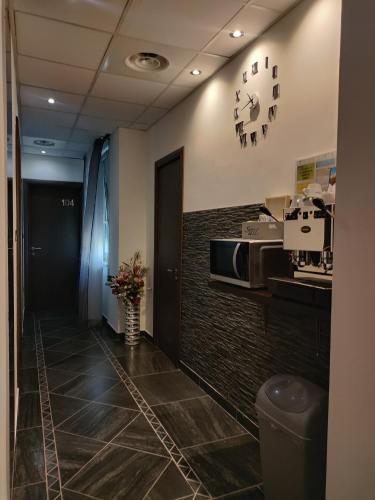 a hallway of a office with a clock on the wall at B&B Adriatico in Giulianova