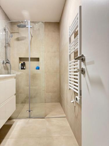 a shower with a glass door in a bathroom at Adriatic Retreat Mljet in Polače