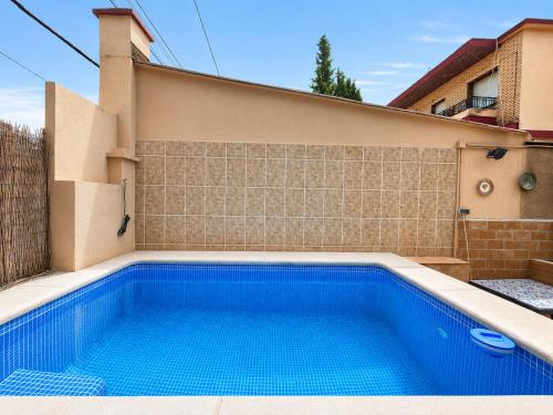 a swimming pool in front of a house at CASA FLORIT - Citrus Villa - BBQ & POOL - 5 Guests in La Eliana