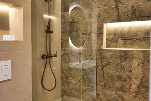 a bathroom with a shower with a glass door at Casa Reyes El Palmar in El Palmar
