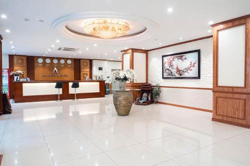 a large lobby with a salon with a chandelier at A25 Premium Hotel - 705 Lac Long Quan in Hanoi