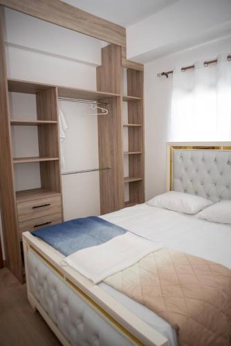 a bedroom with a large bed and a closet at Luxurious Punta Cana House 3 Bedrooms, Shared Pool, BBQ in Punta Cana
