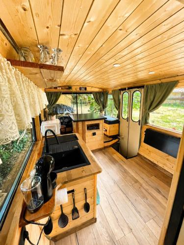an interior view of a kitchen in an rv at Tiny house - Bus insolite - avec Escape Game in Mignaloux-Beauvoir