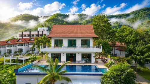 an aerial view of a resort with a swimming pool at Wonderland Resort Chiangmai in Chiang Mai