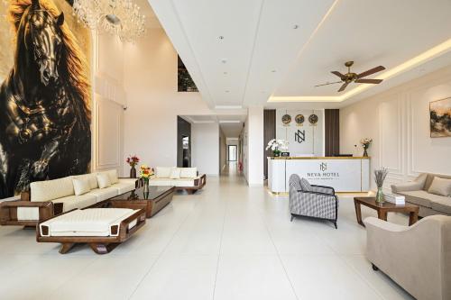a large living room with a horse painting on the wall at Khách sạn Neva in Long An