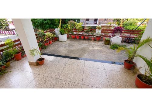 a patio with a bunch of potted plants at Jaiswal Homestay in Jabalpur