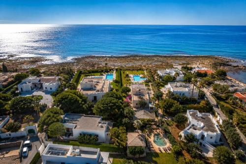 an aerial view of a resort near the ocean at Villa Gemma - Sea Access & Private Pool in Polignano a Mare
