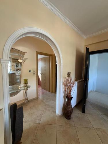 a hallway with a vase of flowers in a room at Villa Kastri in Igoumenitsa