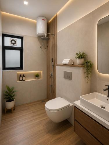 a bathroom with a white toilet and a sink at The Comfort Villa Manage By Bellamount Hotel Free Airport Pick Up & Drop in New Delhi