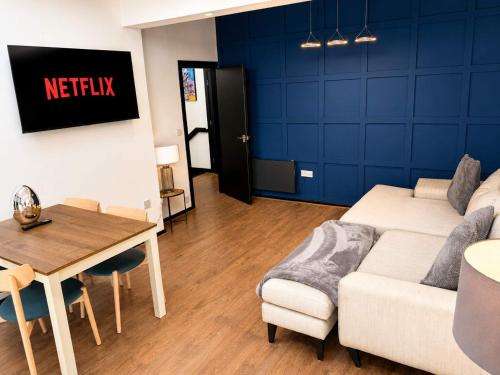 a living room with a couch and a table at The Regent in Warrington