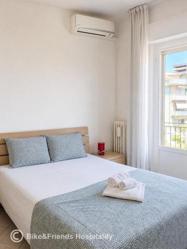 a bedroom with a bed with a towel on it at CASA BETTI in Pesaro