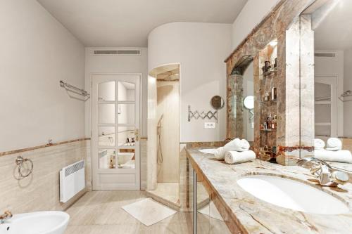 a bathroom with a sink and a mirror at Villa Seize St Tropez in Saint-Tropez