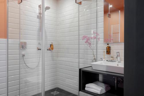 a bathroom with a shower and a sink at ipartment Leverkusen @HOME by Best Western in Leverkusen