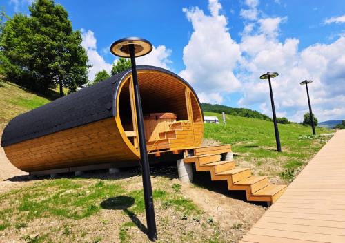 a small wooden boat sitting on top of a field at Salaš Syrex in Zázrivá