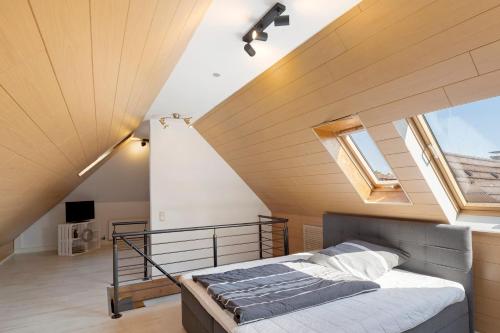 a bedroom with a bed in a attic at Ferienwohnung "Am Waldrand" in Bottrop