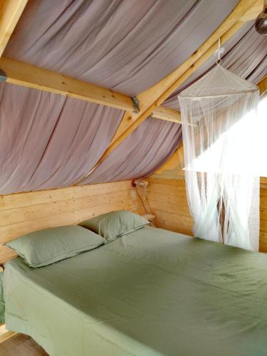 a bedroom with a bed in a tent at Glamping Casacocco' in San Ginesio