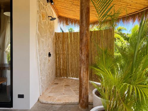 a room with a fence and some plants at SANA Koh Phangan in Salad Beach