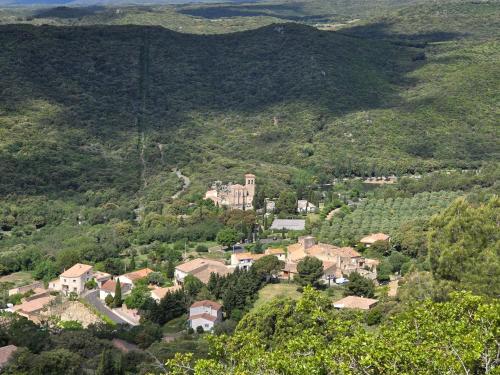 an aerial view of a small village in a mountain at La chambre d'hôtes de l'olivier Gîte A Coeur Vaillant in Vailhan