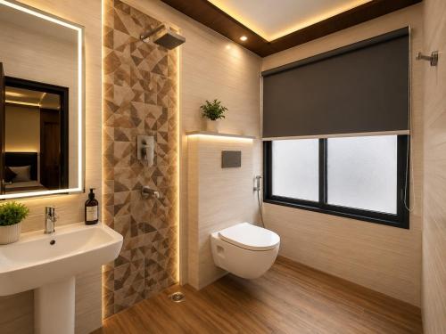 a bathroom with a toilet and a sink and a window at Urben BellaMount Hotel - Free Airport and Aerocity Pick Up & Drop in New Delhi