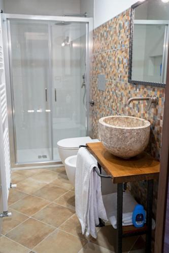 a bathroom with a sink and a toilet and a shower at Borgo Izzo 2 in San Fele