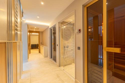 a hallway with a shower and a glass door at Leaf Villa Terra in Antalya
