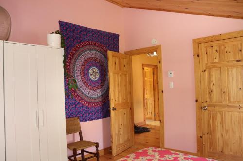 a room with a tapestry hanging on the wall at La Reine in St-Etienne de Bolton