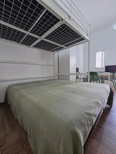 a bedroom with a large bed in a room at AM-MARE in Villaggio Azzurro