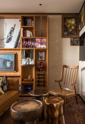 a living room with a couch and a table at Brach Madrid - Evok Collection in Madrid