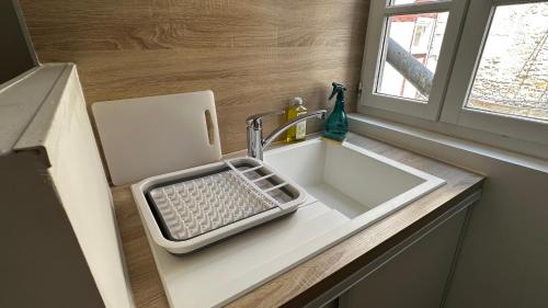 a kitchen sink with a keyboard on a counter at Le Fabuleux - 2 Guests in Dijon