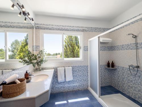 a bathroom with a sink and a shower at Ses Casetes Abajo in San Jose