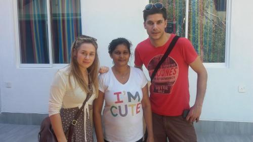 a man and a woman posing for a picture at Araliya White House in Negombo