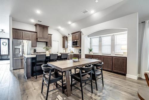 a kitchen and dining room with a table and chairs at Hazy Hollow Escape 4816 in Crowley