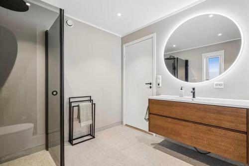 a bathroom with a sink and a mirror at Apartment Lofoten, Leknes in Leknes