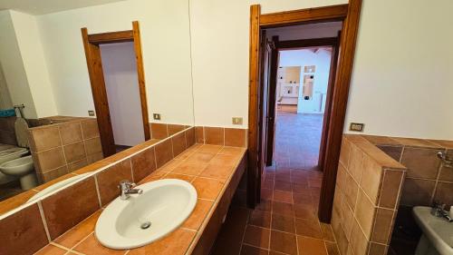 a bathroom with a sink and a mirror at Villa Bruno in Modica