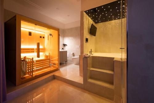 a bathroom with a tub and a sink and a toilet at 3 torri GATEWAY in Maddaloni