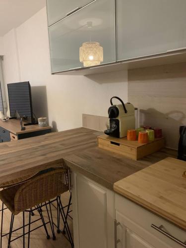 a kitchen with a wooden counter top in a kitchen at Apartment with pool and beach access 2 No 31 in Quiberon