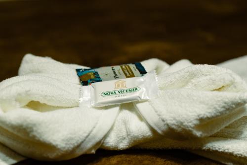 a close up of a towel with a label on it at Nova Vicenza Hotel in Farroupilha