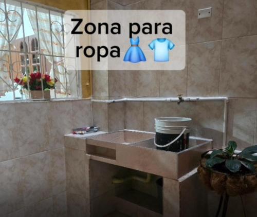 a bathroom sink with a sign that reads zona panapa rapapa at Casa de Descanso la Cascada in Sopetrán