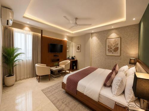 a hotel room with a bed and a desk at Airport NH Skye Suites Hotel Terminal 3, Delhi International Airport With - Free Airport Pickup in New Delhi