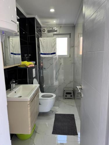 a bathroom with a sink toilet and a shower at Apartmani Rubi 2 in Herceg-Novi