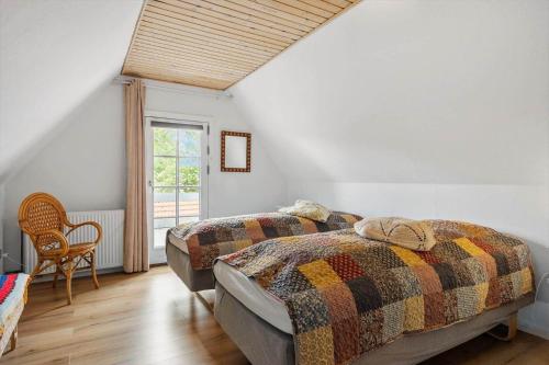 a bedroom with two beds and a window at 6010-Askeby-Fanefjordgade-71 in Askeby