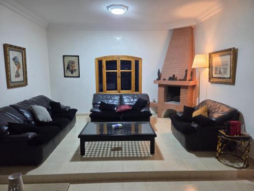 a living room with two couches and a coffee table at la Citronnelle in Oualidia