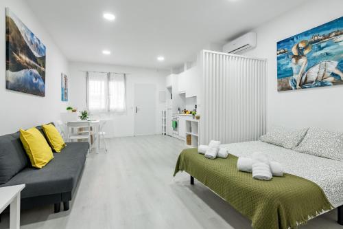 a living room with a couch and a table at Studio New Complete 4 pax in Madrid